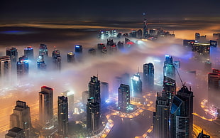 lighted buildings, cityscape, skyscraper, mist, lights HD wallpaper