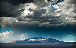 overcloud over mountain during daytime