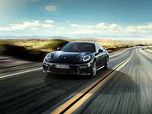 black car sprinting road under blue sky timelapse photography