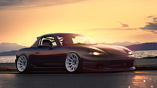 black sports coupe on road during golden hour HD wallpaper
