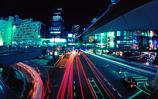 time-lapse photography of vehicle lights on highway road at night