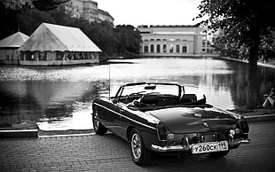 grayscale photography of a convertible coupe near lake HD wallpaper