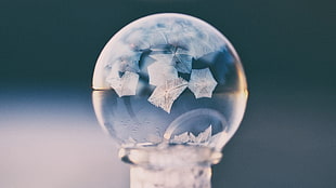 white and blue ceramic figurine, photography, frozen bubble