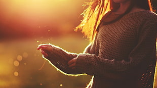 woman wearing knit sweater with sun rays photo