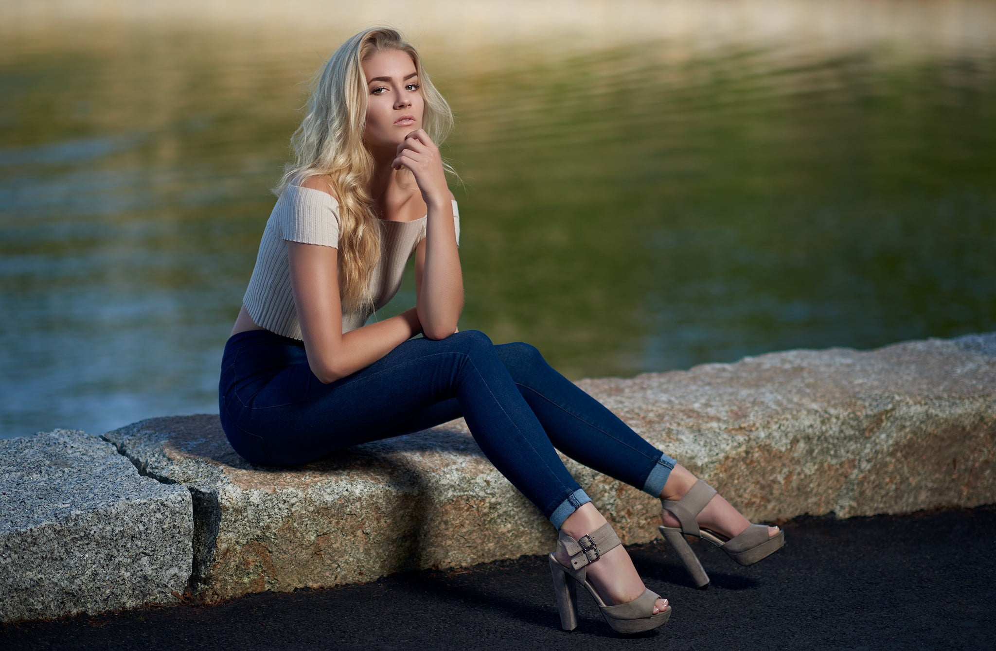 Woman wearing white off-shoulder shirt, blue jeans and brown peep-toe  platform pumps sitting on brown concrete pavement near body of water at  daytime HD wallpaper | Wallpaper Flare