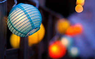 focused photo of blue ball lantern