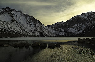 body of water near mountain