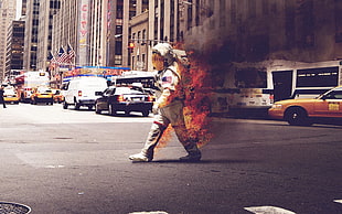 astronaut on fire crossing the street HD wallpaper