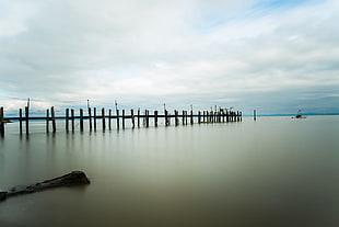 panoramic photography of black wooden boat dock under gray sky HD wallpaper