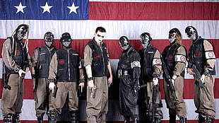 eight men in gray boiler suits and black leather vest holding guns with U.S.A flag background HD wallpaper