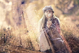 shallow focus photography of girl blowing white Dandelion flower during dayime HD wallpaper