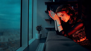 woman sitting on black sofa during nighttime HD wallpaper