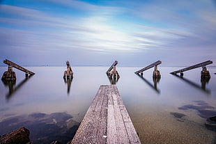 grey dock beside body of water at daytime, marken HD wallpaper
