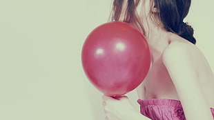 woman in pink strapless top holding red balloon HD wallpaper