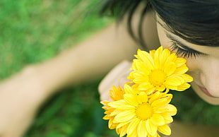 closeup photographt of woman near yellow daisy flowers HD wallpaper