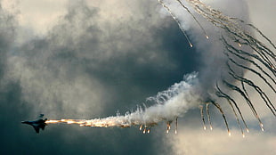 black jetplane, smoke, sky, clouds, fire