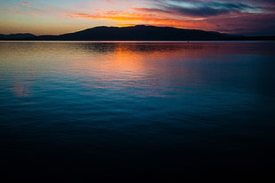 body of water near mountain