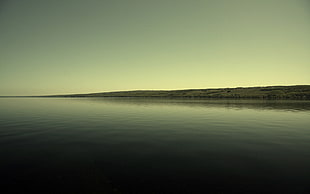 green mountain, water, island, dark, clear sky