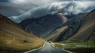 black road between brown mountain, road, mountains, clouds HD wallpaper