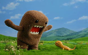 Domo   front of yellow Reptile on green grass field HD wallpaper